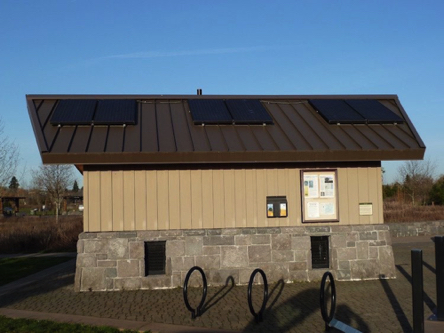 Accessible restroom and bike rack at parking lot &ndash; two accessible parking spaces