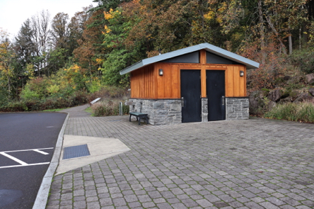 Mather Road from parking lot, crosswalk and curb cut – unisex restrooms – interpretive displays – drinking fountain – trailhead Mather Road from parking lot, crosswalk and curb cut – unisex restrooms – interpretive displays – drinking fountain – trailhead