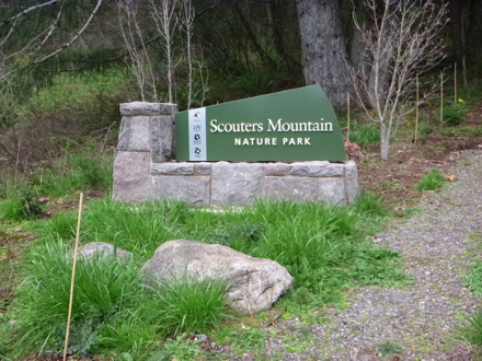 Entrance sign for Scouters Mountain Nature Park – park is open sunrise to sunset Entrance sign for Scouters Mountain Nature Park – park is open sunrise to sunset