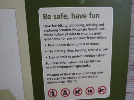 Sign with hours and rules – park is open sunrise to sunset Sign with hours and rules – park is open sunrise to sunset