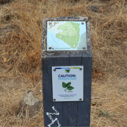 Post topped with map of trails on Elk Rock Island – poison oak Post topped with map of trails on Elk Rock Island – poison oak